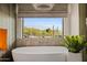 Close-up of a luxurious soaking tub in a bathroom with picturesque views at 9301 E Via Montoya --, Scottsdale, AZ 85255