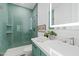 Modern bathroom featuring a tiled glass shower and vanity with a quartz countertop and Kohler sink at 9301 E Via Montoya --, Scottsdale, AZ 85255