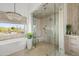 This bathroom features a soaking tub, shower, and views at 9301 E Via Montoya --, Scottsdale, AZ 85255
