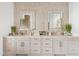 A large bathroom vanity features double sinks and framed mirrors at 9301 E Via Montoya --, Scottsdale, AZ 85255