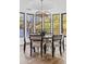 Dining space with unique chandelier and black framed windows bringing in natural light at 9301 E Via Montoya --, Scottsdale, AZ 85255