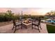 Outdoor firepit area with comfortable seating, desert views, and lush landscaping near pool at 9301 E Via Montoya --, Scottsdale, AZ 85255