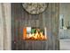 Modern fireplace with decorative stone accent wall and contemporary mantel design in living area at 9301 E Via Montoya --, Scottsdale, AZ 85255