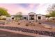 Stunning modern home with desert landscaping, circular driveway, and elegant front entrance at 9301 E Via Montoya --, Scottsdale, AZ 85255