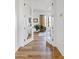 A hallway with hardwood flooring, leading to a bright office at 9301 E Via Montoya --, Scottsdale, AZ 85255