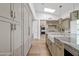 Well-equipped kitchen with stainless appliances, large island, and light wood floors at 9301 E Via Montoya --, Scottsdale, AZ 85255