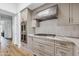 Modern kitchen with stainless appliances, light gray cabinets, and marble countertops at 9301 E Via Montoya --, Scottsdale, AZ 85255