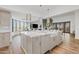 Spacious kitchen with large island, marble countertops, pendant lights and modern appliances at 9301 E Via Montoya --, Scottsdale, AZ 85255