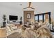 Bright living room with tile accent wall, ceiling fan and comfortable seating at 9301 E Via Montoya --, Scottsdale, AZ 85255