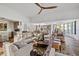 Bright living room features stylish furnishings and seamlessly connects to kitchen and dining areas at 9301 E Via Montoya --, Scottsdale, AZ 85255
