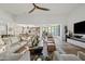Bright living room features stylish furnishings and seamlessly connects to kitchen and dining areas at 9301 E Via Montoya --, Scottsdale, AZ 85255
