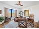 This office has a hardwood floor, a wooden ceiling fan, and many windows at 9301 E Via Montoya --, Scottsdale, AZ 85255