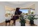 Charming piano room with an elegant piano, a modern chandelier, and scenic outdoor views at 9301 E Via Montoya --, Scottsdale, AZ 85255