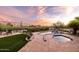 Beautiful outdoor entertaining area featuring a pool, spa, travertine patio, and desert views at 9301 E Via Montoya --, Scottsdale, AZ 85255