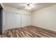 Bright bedroom with wood-look floors and double closets at 9455 E Raintree Dr # 1025, Scottsdale, AZ 85260