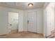 Bright foyer featuring tile flooring, a front door with glass detail, and a half bathroom at 9455 E Raintree Dr # 1025, Scottsdale, AZ 85260