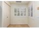 Bright laundry room featuring tile floors and shuttered window at 9455 E Raintree Dr # 1025, Scottsdale, AZ 85260