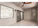 Relaxing screened-in patio with ceiling fan and sliding door for seamless indoor-outdoor living at 9455 E Raintree Dr # 1025, Scottsdale, AZ 85260