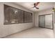 Screened-in patio with ceiling fan and sliding glass door provides an outdoor living space at 9455 E Raintree Dr # 1025, Scottsdale, AZ 85260
