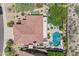 Aerial view of a private pool with hot tub and putting green at 10415 E Rosemary Ln, Scottsdale, AZ 85255