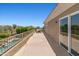 Expansive balcony with a view of pool, nearby vegetation and landscaping, and mountain ranges at 10415 E Rosemary Ln, Scottsdale, AZ 85255