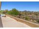 Open air balcony with a view of shrubs and vegetation, desert landscape and distant mountains at 10415 E Rosemary Ln, Scottsdale, AZ 85255