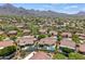 Aerial view of a residential community with mountain views at 10415 E Rosemary Ln, Scottsdale, AZ 85255