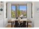 Breakfast nook features a wood table with seating, backyard views, and lots of natural light at 10415 E Rosemary Ln, Scottsdale, AZ 85255