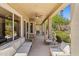 Covered patio area with ample seating and ceiling fans, perfect for relaxing and entertaining at 10415 E Rosemary Ln, Scottsdale, AZ 85255