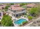 Aerial view of a private pool with hot tub and covered patio at 10415 E Rosemary Ln, Scottsdale, AZ 85255