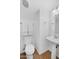 Simple, clean half bathroom with white fixtures and a pedestal sink at 1069 S Nancy Ln, Gilbert, AZ 85296