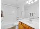 Bathroom with tub and shower combo, vanity, and a large mirror at 1069 S Nancy Ln, Gilbert, AZ 85296