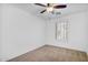 Bedroom featuring neutral carpeting and a window with plantation shutters at 1069 S Nancy Ln, Gilbert, AZ 85296