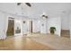 Open living room featuring tiled and carpeted floors, neutral tones, and patio access at 1069 S Nancy Ln, Gilbert, AZ 85296