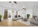 Bright living room with neutral tones, stylish furniture, and access to outdoor patio at 1069 S Nancy Ln, Gilbert, AZ 85296