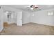 Spacious main bedroom featuring neutral carpeting, ceiling fan, and natural lighting at 1069 S Nancy Ln, Gilbert, AZ 85296