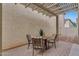 The covered patio features stylish pavers, ideal for relaxation or entertaining guests outdoors at 1069 S Nancy Ln, Gilbert, AZ 85296