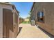 Private backyard with a spacious patio, shed, and well-maintained landscaping at 11580 N 145Th Ave, Surprise, AZ 85379