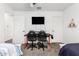 Shared bedroom with a desk, two chairs, and closet at 11580 N 145Th Ave, Surprise, AZ 85379