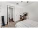 Cozy bedroom featuring a built-in desk and closet with sliding doors at 11580 N 145Th Ave, Surprise, AZ 85379