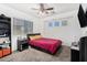 Comfortable bedroom with a ceiling fan and window offering natural light at 11580 N 145Th Ave, Surprise, AZ 85379