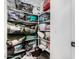 Organized walk-in closet featuring shelves filled with bags and neatly folded linens at 11580 N 145Th Ave, Surprise, AZ 85379