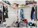 Walk-in closet featuring multiple storage baskets, drawers, and a variety of clothing at 11580 N 145Th Ave, Surprise, AZ 85379