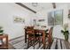 Cozy dining room with wooden table and chairs set, bright lighting, and neutral decor at 11580 N 145Th Ave, Surprise, AZ 85379