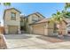 Charming two-story home featuring desert landscaping, and an attached two-car garage at 11580 N 145Th Ave, Surprise, AZ 85379