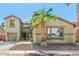 Charming two-story home featuring desert landscaping, and an attached two-car garage at 11580 N 145Th Ave, Surprise, AZ 85379