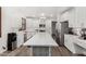 Modern kitchen features an island with counter seating and modern pendant lights at 11580 N 145Th Ave, Surprise, AZ 85379