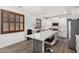 Bright, open kitchen features white cabinets, stainless steel appliances, and quartz countertops at 11580 N 145Th Ave, Surprise, AZ 85379