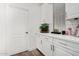 Laundry room featuring white cabinets, countertop space, and modern finishes at 11580 N 145Th Ave, Surprise, AZ 85379