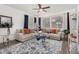 Bright living room featuring neutral furniture, modern decor, and ample natural light at 11580 N 145Th Ave, Surprise, AZ 85379